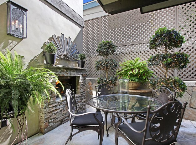 Photo a patio with a table and chairs and a sign that says  garden