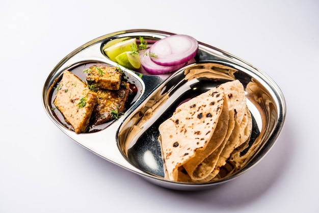 Patodi Rassa Bhaji or patwadi Sabji, a popular Maharashtrian spicy recipe served with Chapati and salad. Selective focus