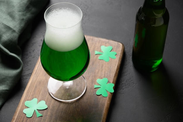 Patrick's day green beer in glass on black