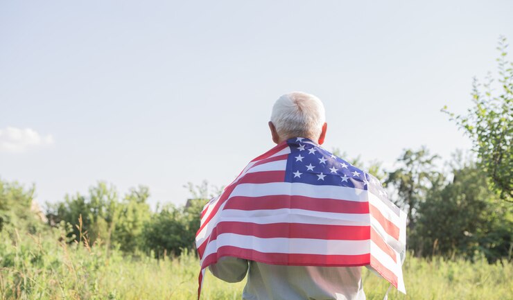 Patriotic senior man with the American flag