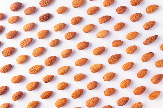 Photo pattern of almond nuts on a white background