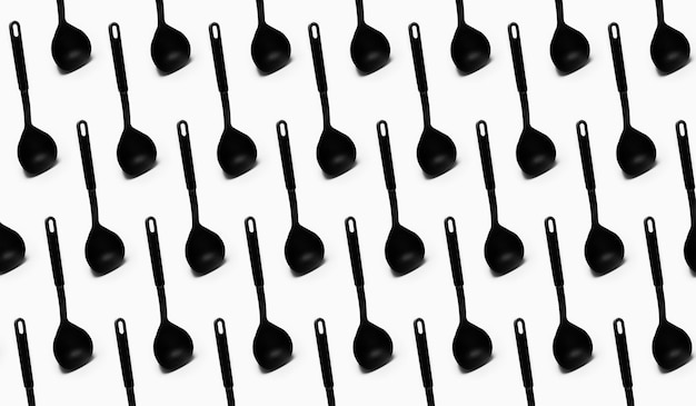 Photo pattern of black plastic ladle spoon on white background