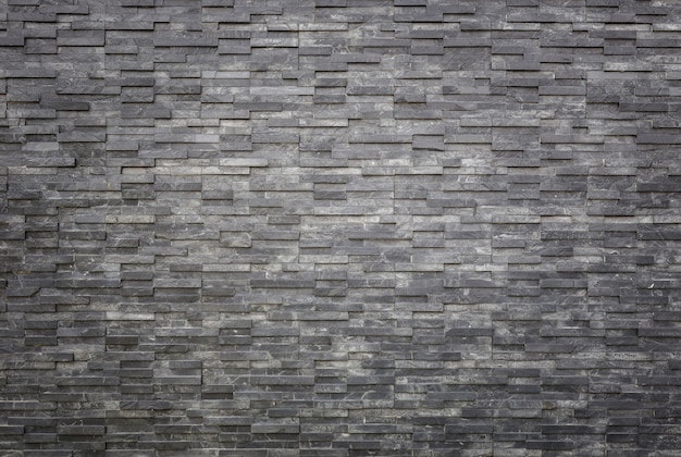 Pattern of black slate wall texture and background. Interior or exterior decoration