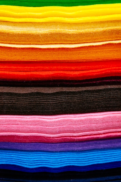 Pattern of colorful pieces of clothes sorted by color