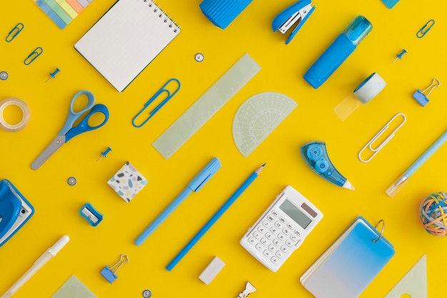 Pattern composition of school stationery on a yellow background Back to school concept