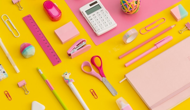 Pattern composition of school stationery on a yellow background. Top view. Flat lay. Back to school concept.