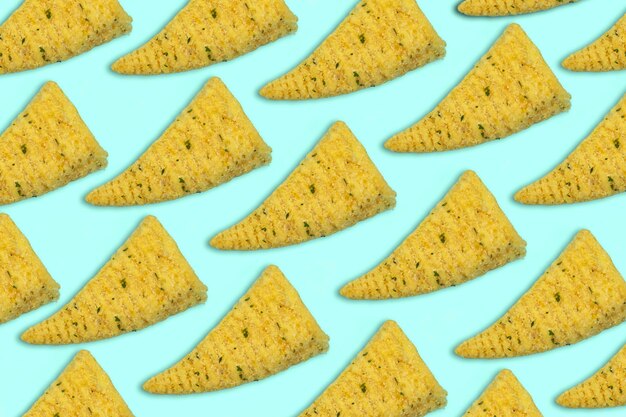 pattern of cone corn chips on blue background