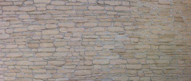 Pattern of decorative stone on the wall House wall facade background