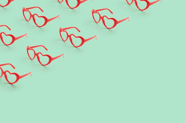 파스텔 색 배경에 빨간 심장 모양의 선글라스로 만든 패턴 발렌타인 데이 콘셉트
