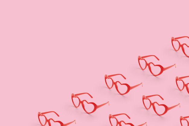 Pattern made with red heart shaped sunglasses on pastel color background