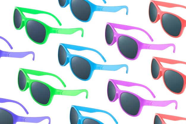 Pattern of many sunglasses of different colors on white