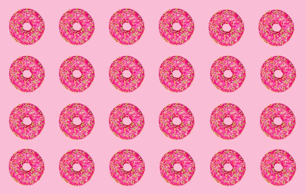 ピンクの背景にピンクのドーナツのパターン