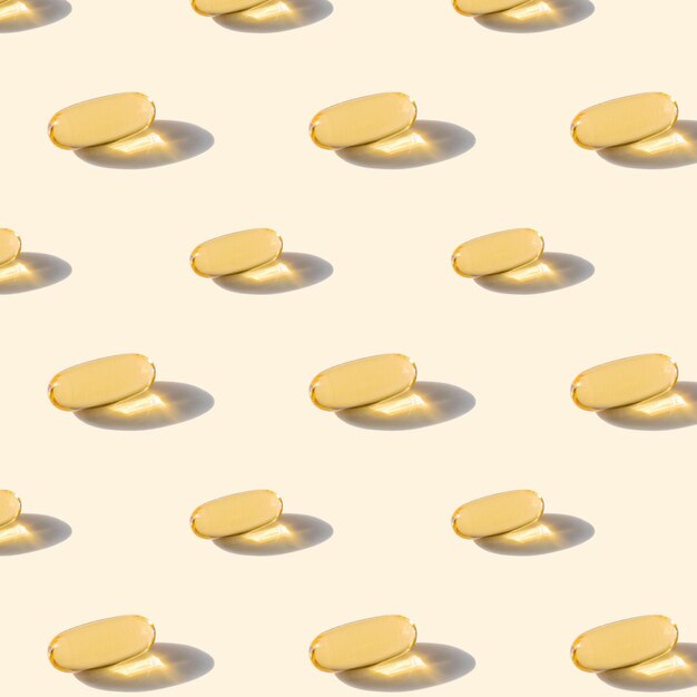 A pattern of omega capsules on a beige background