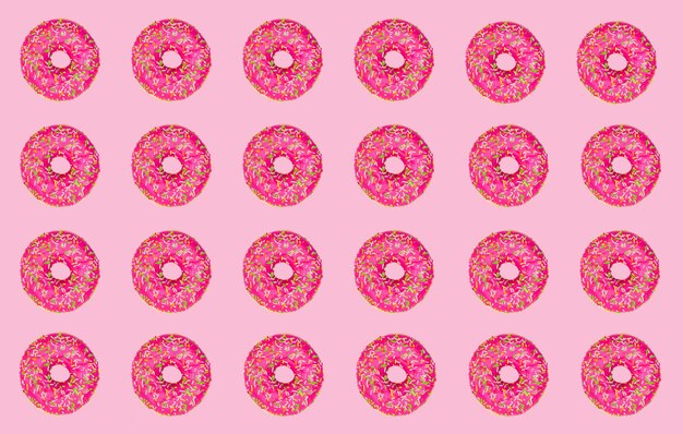 Pattern of pink donuts on a pink background