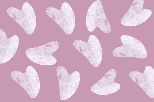 Pattern of pink jade guasha massagers or natural stone scrapers