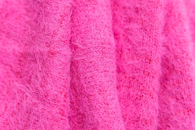 Photo pattern of pink knitted sweater closeup