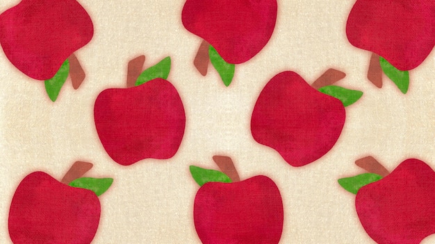 テクスチャーのある布地に緑の葉が付いた赤いリンゴのパターン
