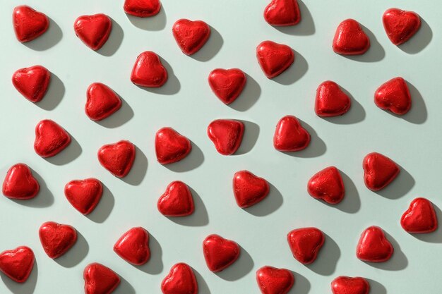 Pattern of red sweets romantic as heart on blue valentines day