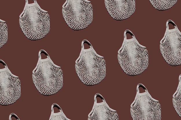 Photo pattern of reusable bags on a brown background for eco shopping