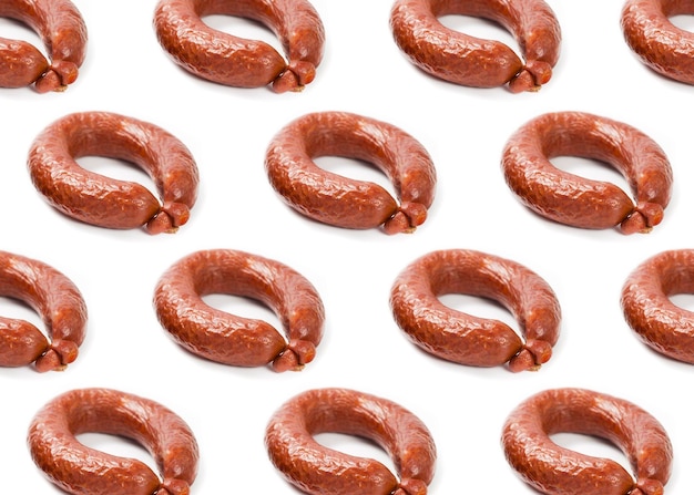 Pattern with boiled and smoked sausage on a white background 2