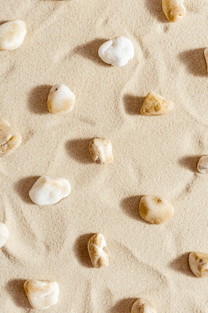 Pattern with pebble sea stones on sand Natural stone neutral beige yellow color monochrome tones