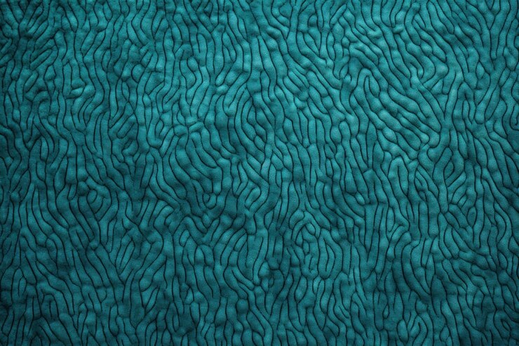 Photo patterned carpet texture in turquoise from above ar 32 v 52 job id 00948d1be5804d67ba4325e0327354f8