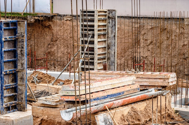 Pavement repair and laying of paving slabs on the walkway,\
stacked tile cubes on the background. laying paving slabs in the\
pedestrian zone of the city, sand filling. road tiles and\
curbs.