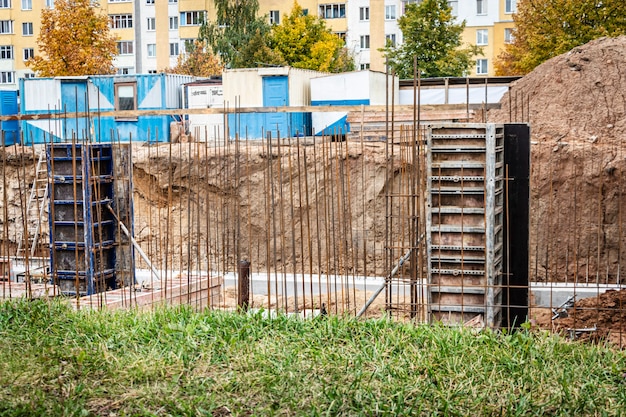 Pavement repair and laying of paving slabs on the walkway,\
stacked tile cubes on the background. laying paving slabs in the\
pedestrian zone of the city, sand filling. road tiles and\
curbs.