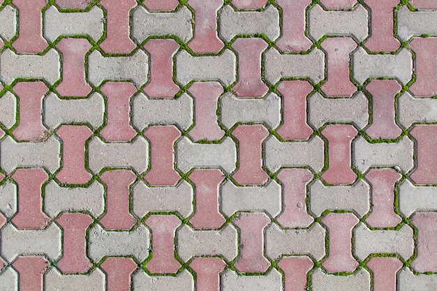 Photo paving slabs paving stones brick pavement as a background