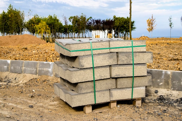 Paving stone. Road and park construction. Arrangement of parks and walking paths.