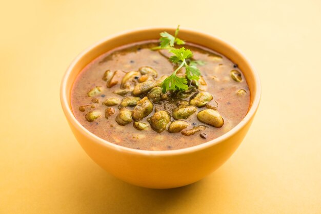 Pavta Bhaji or Lima Beans Curry Recipe also known as Popat Dana sabzi in India, served in a bowl