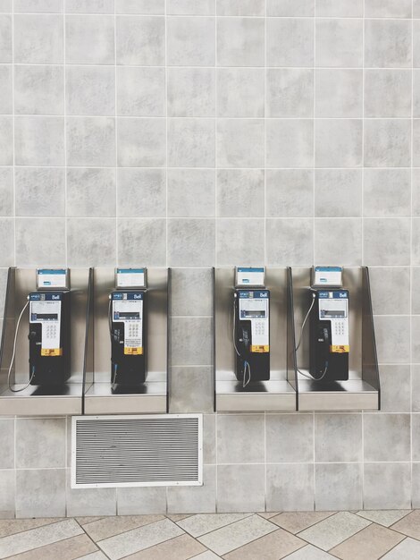 Photo pay phones mounted on wall