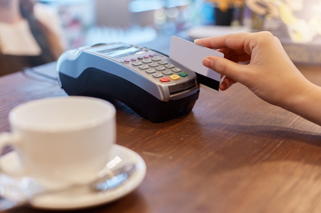 Paying with credit card for purchase in cafeteria