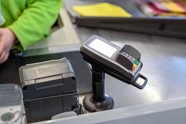 Payment terminal for plastic cards at the store with space for layout, mock up