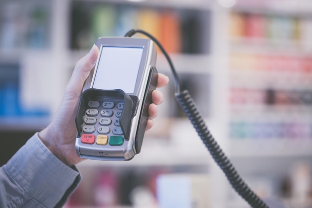 Payment terminal in a shop paying by card