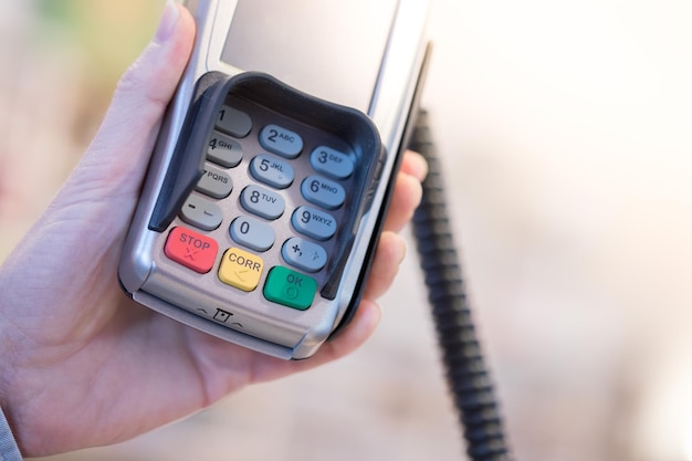 Photo payment terminal in a shop paying by card