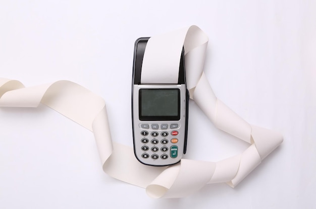 Payment terminal with cash tape on white background Top view