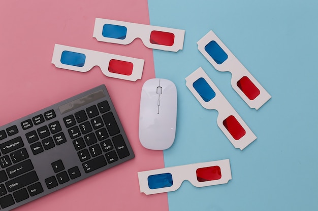 PC keyboard with 3d glasses on pink blue. Entertainment