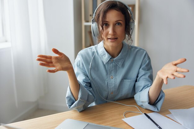 Pc software failure angry businesswoman lost all important\
documents due laptop breakdown working at home office curly\
irritated adorable lady in headphones raise hands up raging after\
crash error