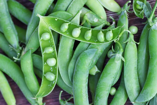 Pea pod on the wooden background