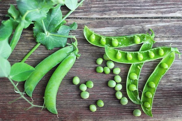 Pea pod on the wooden background