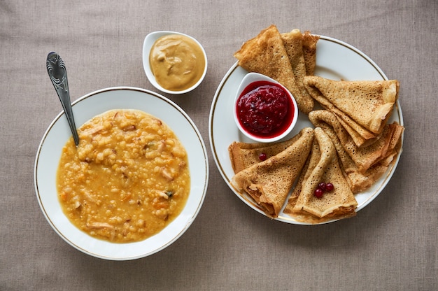 Pea soup and pancakes with lingonberry sauce