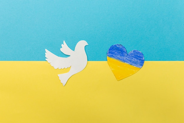 Peace dove with heart in flag colors of Ukraine No war stop war