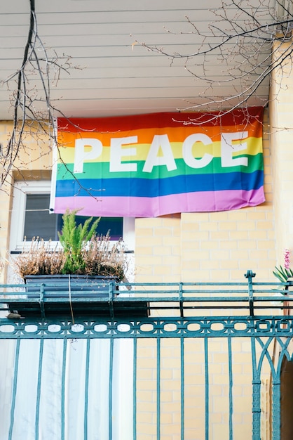 Peace rainbow flag on the balcony Symbol LGBT movement text peace