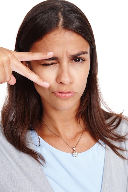 Photo peace sign funny and woman portrait of a model with a pout comic and duck face white background isolated and vertical female pose with comedy and joke hand sign with wink alone in studio