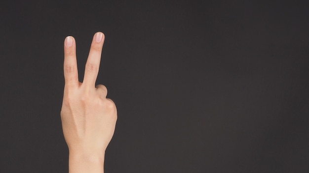 Peace sign.It is hand gesturing two finger on white background