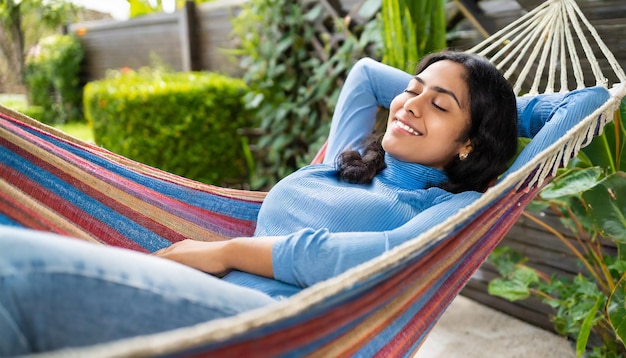 Photo peaceful adult woman taking a nap in hammock in house garden backyard