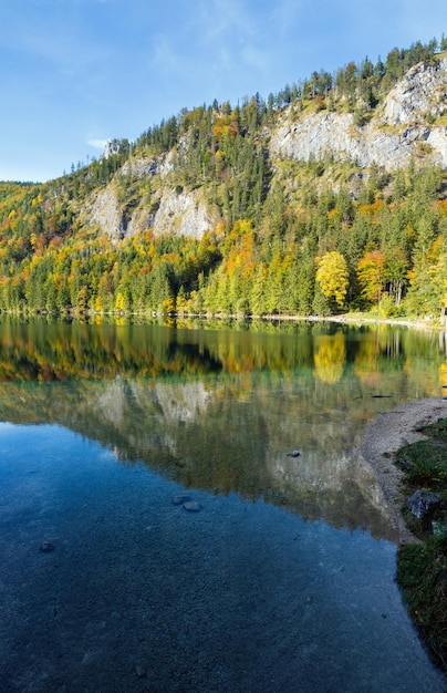 Peaceful autumn Alps mountain lake with clear transparent water and reflections Langbathseen lake Upper Austria