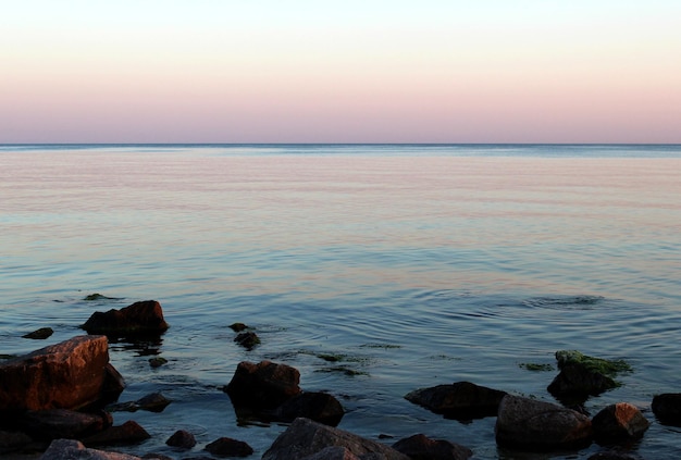 Peaceful calm seascape Purple and pink sea sunset