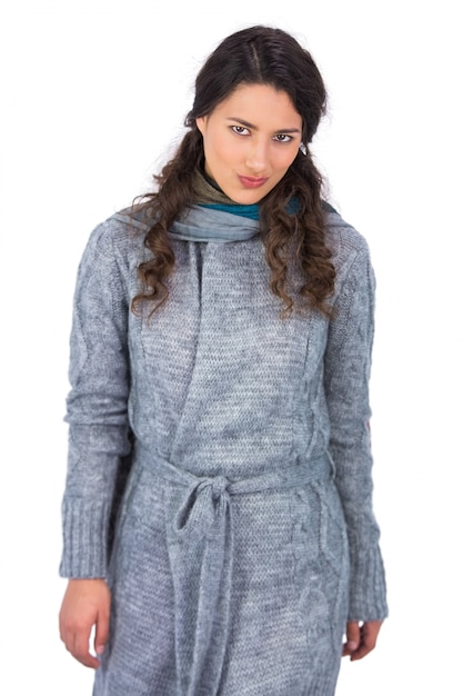 Peaceful curly haired model with winter clothes posing